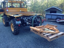 Forks on rear 3 point hitch.  Work very well.